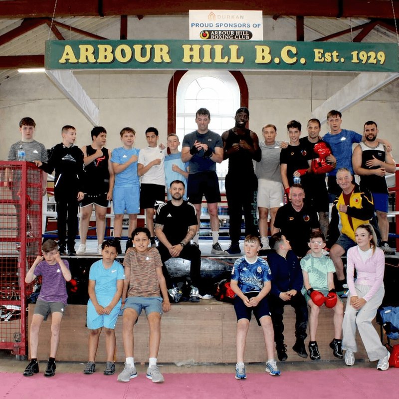 The whole club in the ring under the 1929 sign